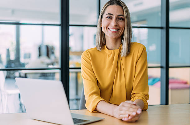 istock Successful businesswoman in modern office working on laptop. 2239489843