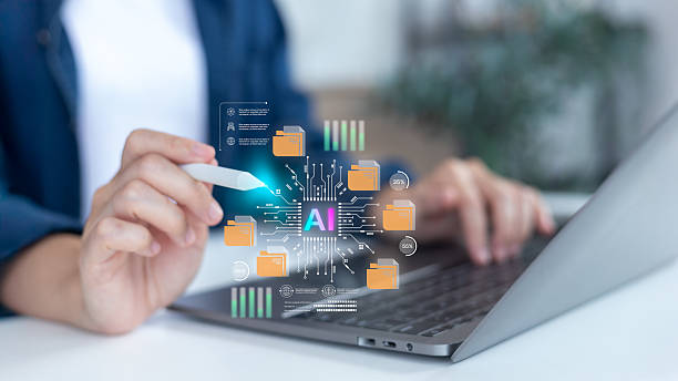 istock A person using a laptop and digital pen with virtual AI data folders and analytics icons, representing artificial intelligence, machine learning, and data management technology concept. 2239489850