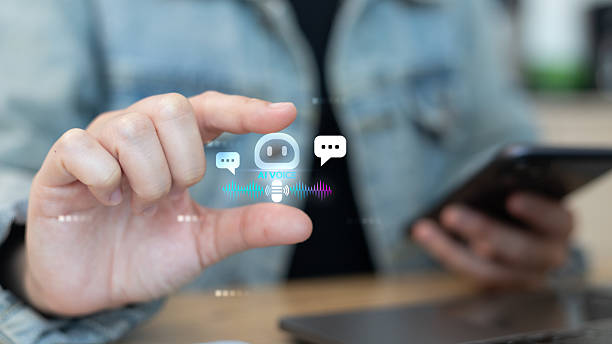 istock A person holding a smartphone and interacting with a virtual AI voice assistant and chatbot icons, representing artificial intelligence, communication, and smart technology concept. 2239489854