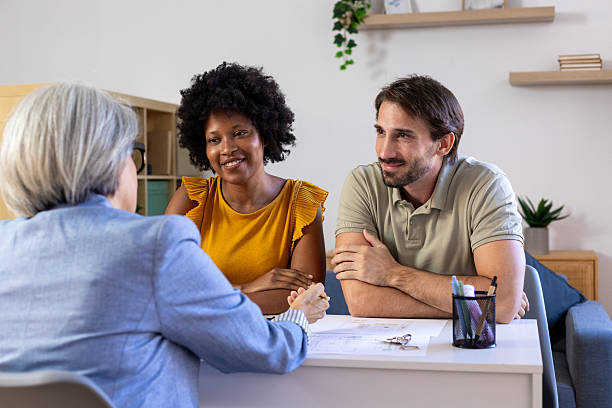istock Diverse couple meeting financial advisor for consultation 2239490214