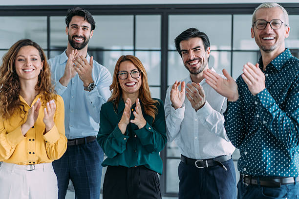 istock Businesspeople applauding during a seminar in conference hall. 2239490499