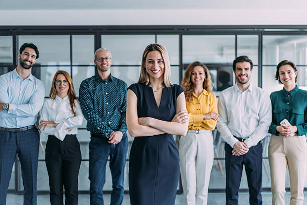 istock Confident businesswoman and her team. 2239490526