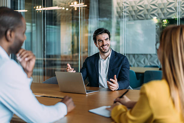 istock Group of business persons talking in the office. 2239490814