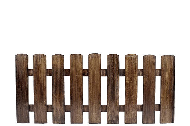 istock Rustic wooden fence with vertical planks and warm texture. 2239496172
