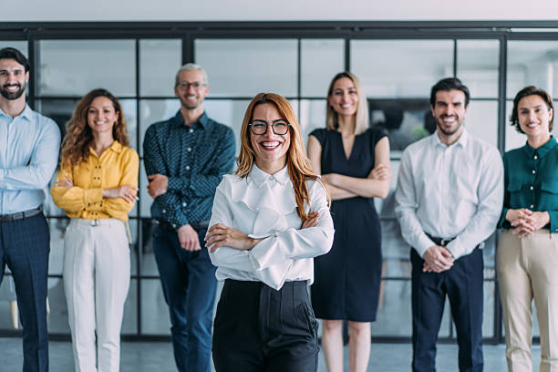 istock Confident businesswoman and her team. 2239496949