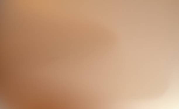 istock Blurred gradient in beige tones of tanned skin. Beige gradient smoothly transitions into a universal nude tone. Blurred cover creates a neutral atmosphere, suitable for banners and flyers. 2239497051