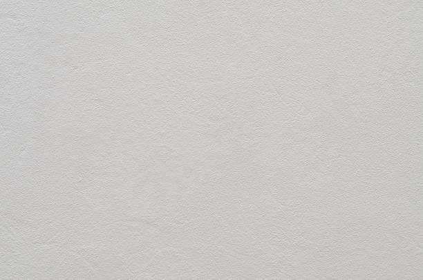 istock The soft, uneven texture of a light gray wall, creating a clean and simple backdrop perfect for a wide range of minimalist or product-focused compositions. 2239499785