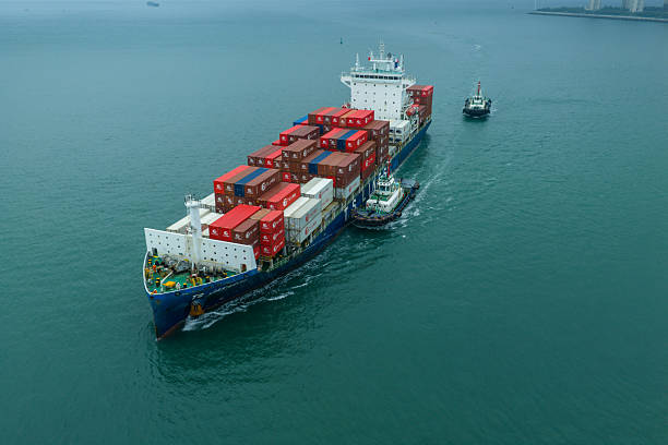 Aerial view of tugboat in leaving port for pilotting.