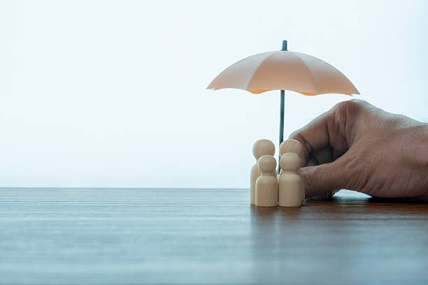 istock Umbrella and wooden dolls with copy space. 2239501025