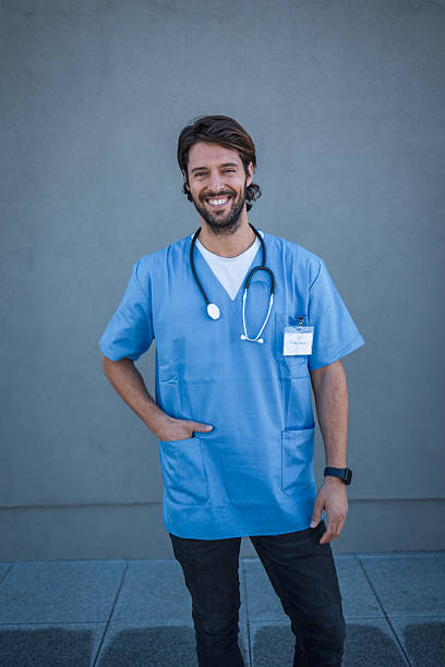 istock Young latin doctor smiling with stethoscope and badge 2239504640