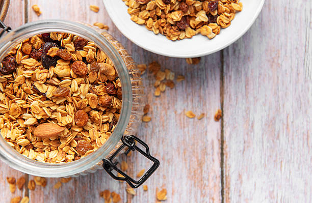 istock Granola cereal in glass jar, healthy breakfast concept 2239508435