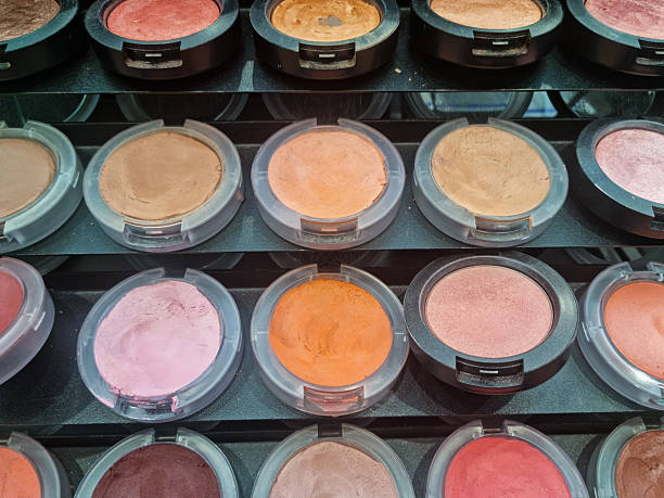 Woman testing multi colored eyeshadow.