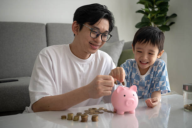 istock Piggy Bank Moments: Father and Son Financial Lessons 2239517948