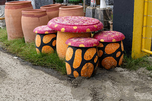 Colorful Cement Mushroom Table and Stools in Garden.