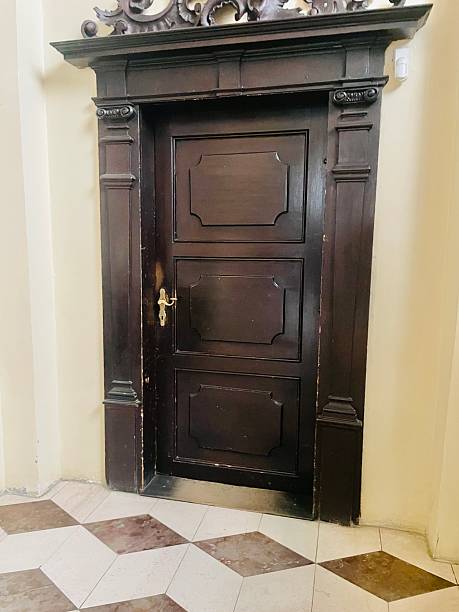 istock A Beautiful Antique Wooden Door Complete with an Elegantly Decorated Frame 2239521918
