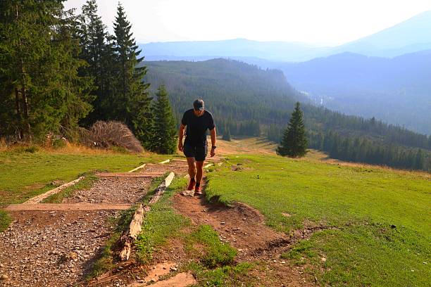Zakopane, Poland - September 05, 2025: Hiker on a trail with a scenic mountain view