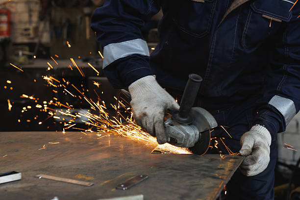 istock A man is actively grinding and shaping a piece of metal using a grinder 2239528402