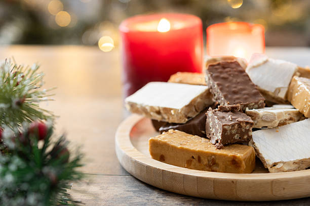 istock Assorted traditional Christmas nougat on wooden plate 2239530758