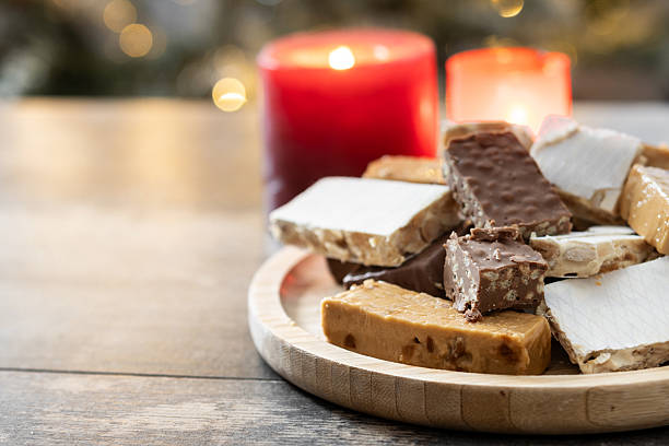 istock Assorted traditional Christmas nougat on wooden plate 2239530772