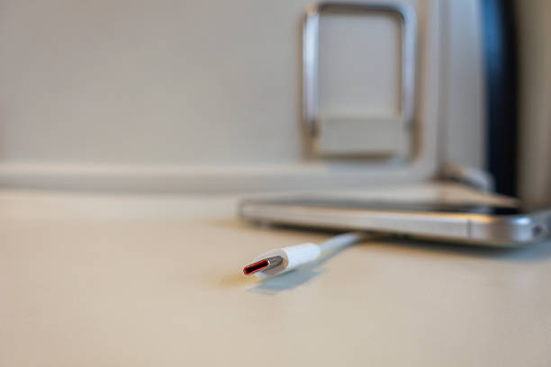 Smartphone charging on the table of a moving train