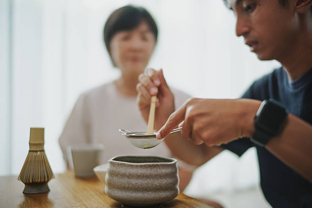 Matcha making with young man and mature woman.