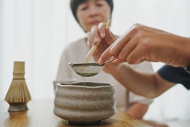 Matcha making with young man and mature woman.