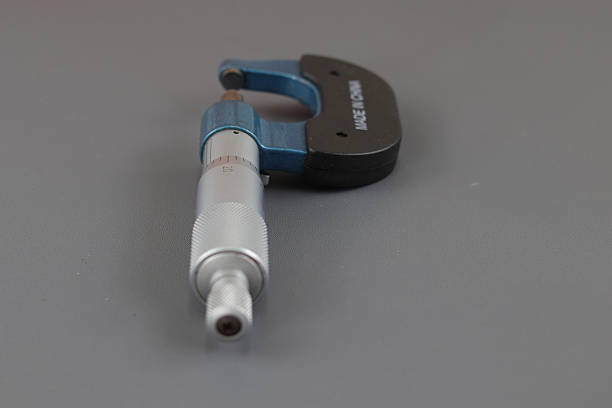 technician inspector using quality control tools in industry fabrication factory