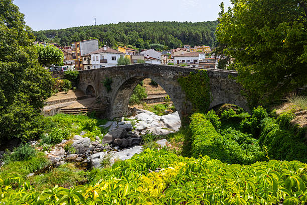istock Ancient stone bridge crossing a river displaying historic architecture 2239544637