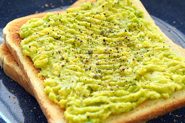 istock Avocado toast healthy breakfast. Mashed avocado on toast. 2239545367