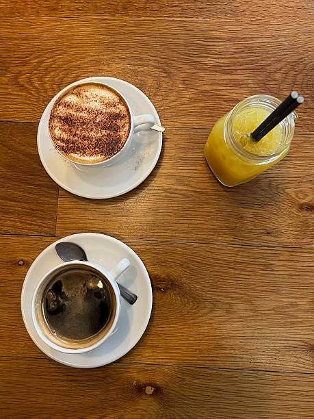 A cappuccino, coffee and orange juice.