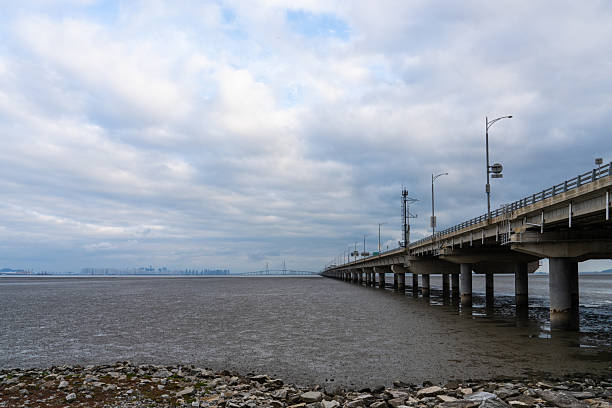 istock mudflat beach and sea with a long bridge 2239549355