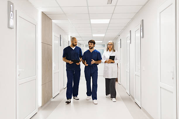 istock Doctors Walking in Hospital Corridor 2239549435