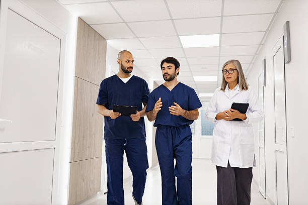 istock Doctors Walking in Clinic Hallway 2239549436