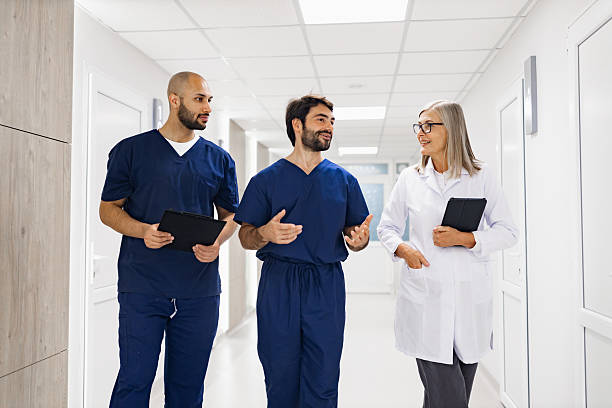 istock Doctors Walking in Clinic Hallway 2239549443