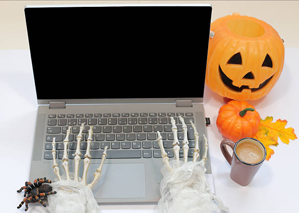 istock Skeleton Hands Typing on Laptop with Coffee Cup, Spider, Pumpikn, autumn leaves, Halloween Work Concept 2239550531