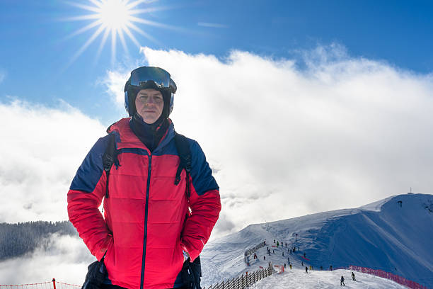 istock A skier in front of snow-covered mountains, getting ready for a descent 2239550885