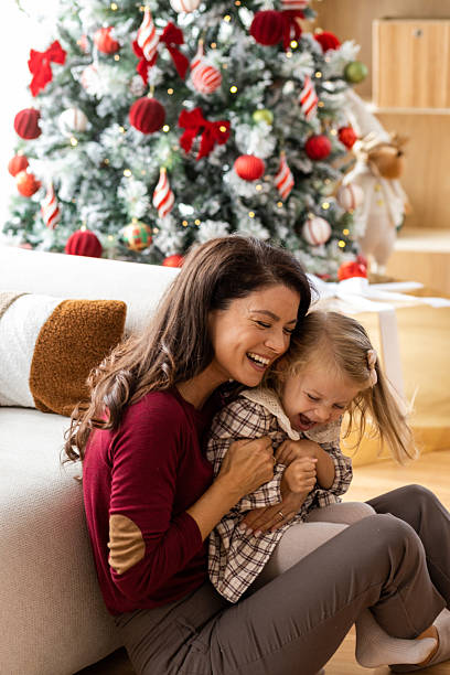 istock Laughing Mother and Child during Christmas 2239551544