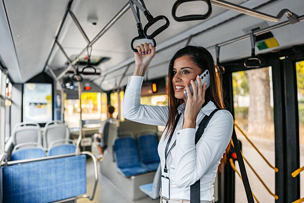 istock Young Businesswoman Talking On Her Phone While Riding A Bus 2239552341