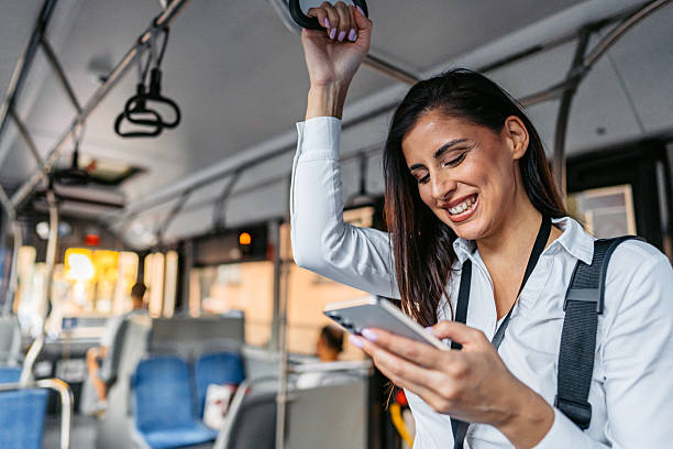 istock Young Businesswoman Using Her Phone While Riding A Bus 2239552743