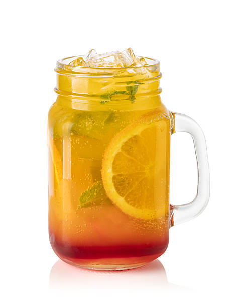 istock Glass with orange lemonade and ice 2239553472