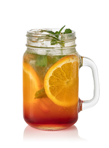 istock Glass with orange lemonade and ice 2239553475