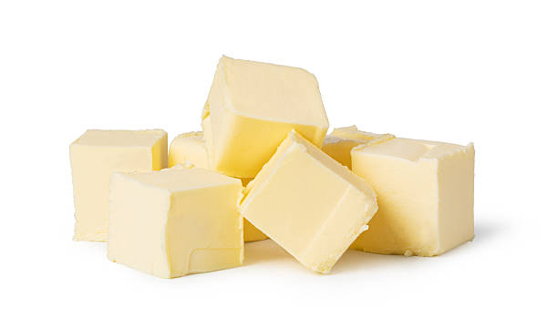 istock Butter block and slices resting on white background 2239554529