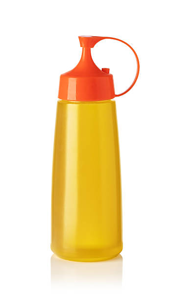 istock Yellow squeeze bottle with orange cap containing cooking oil on white background 2239555039