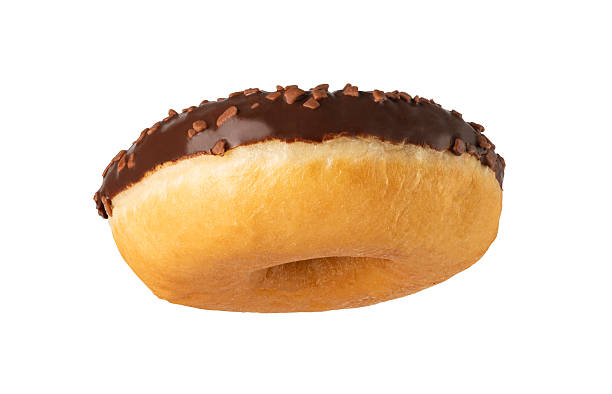 istock Delicious donut with chocolate icing and chocolate sprinkles floating on white background 2239555210
