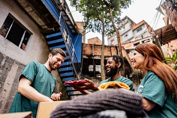 istock Volunteers arranging items for donation outdoors 2239555545