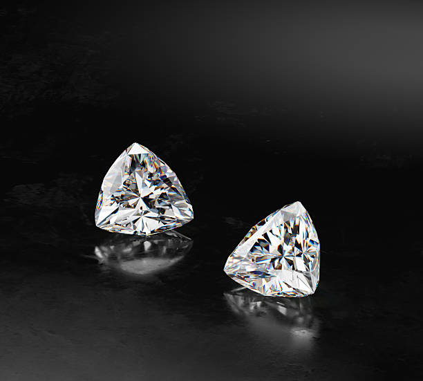 istock 3D render group trilliant diamonds with caustic placed on glossy blackground 2239556164