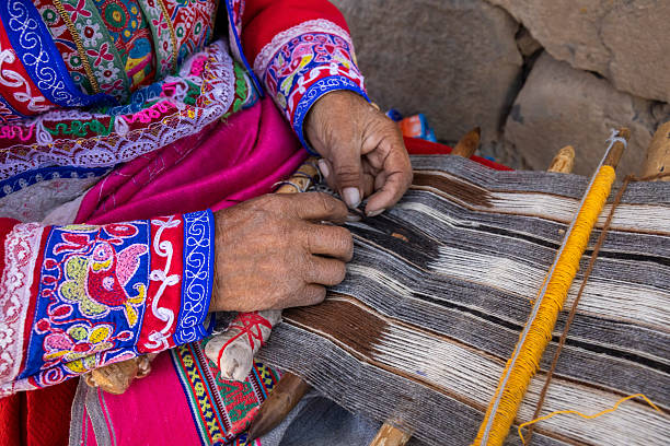 istock Peruvian woman weaving near Colca Canyon, Peru 2239556471