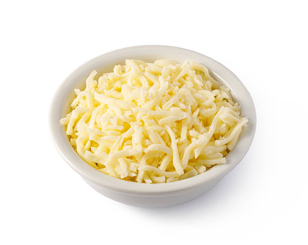 istock Grated cheese overflowing a small white bowl 2239556773