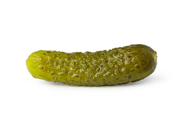 istock Pickled cucumber lying horizontally on white background 2239556860
