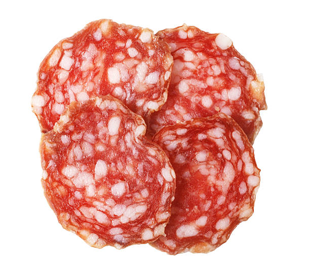 istock Salami slices isolated on white background 2239557286